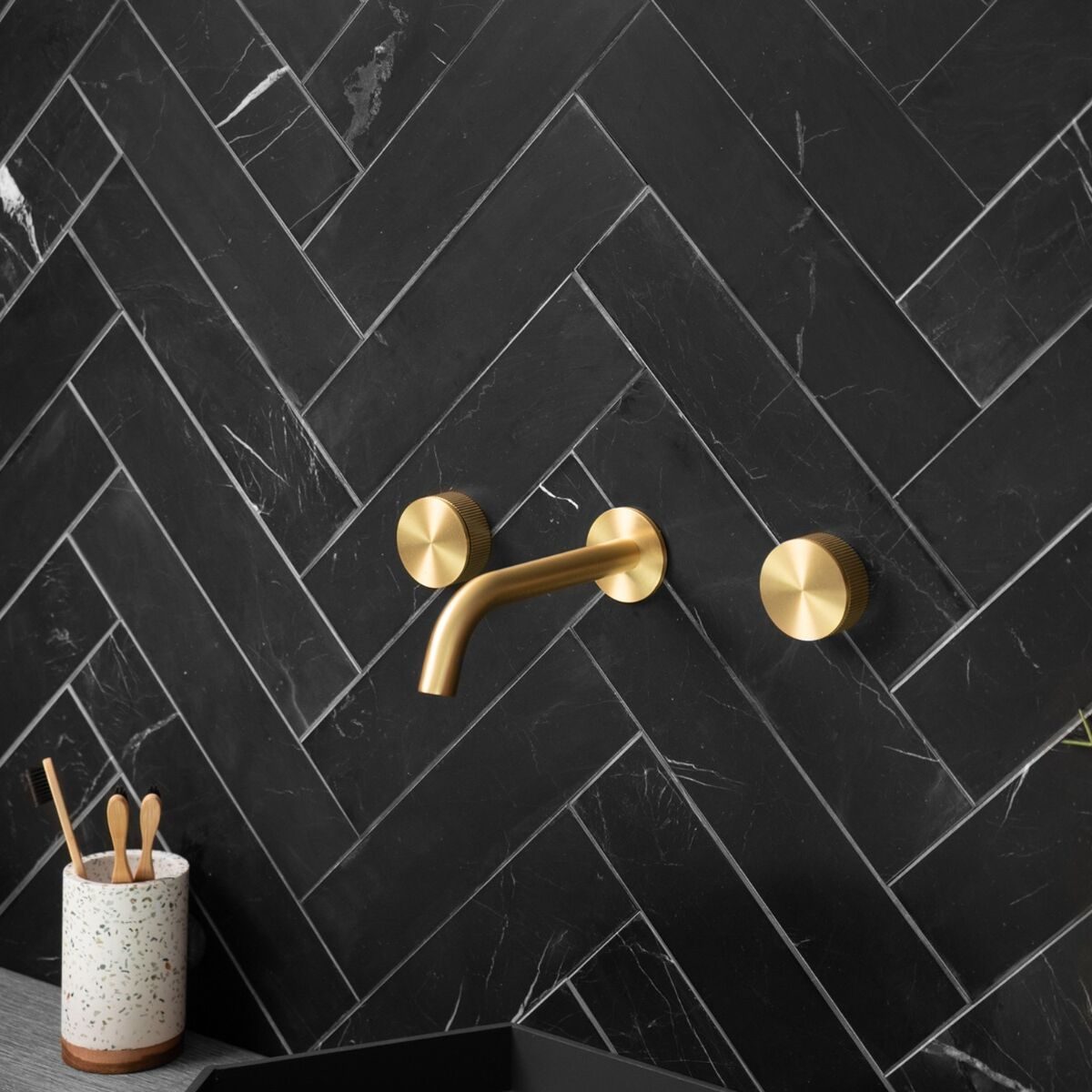 Black-Marble-Metro-Herringbone-Tiles-e1700139788371